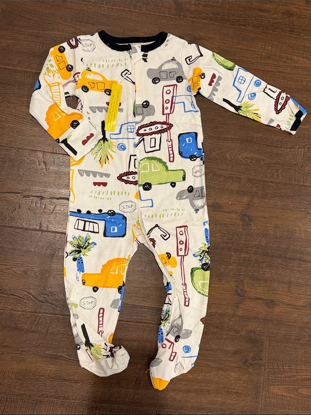 White Footed One-Piece Pajamas with Multicolor Vehicle Print